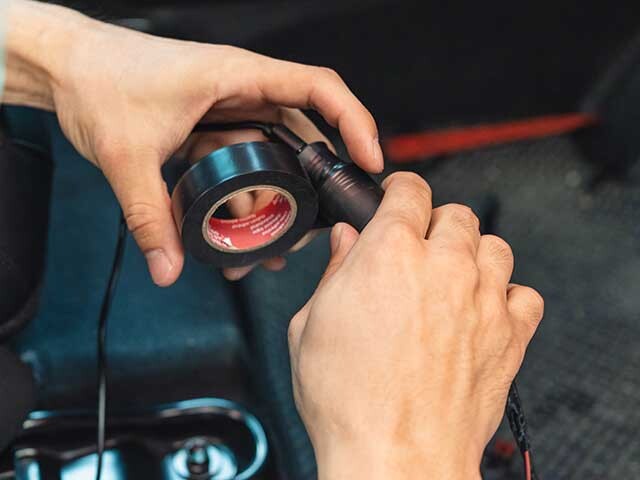 tape being wrapped around a tool