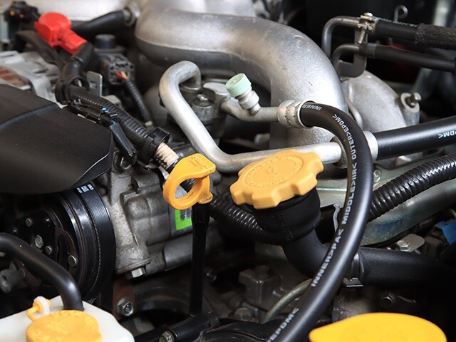 engine bay with tape and wire harness