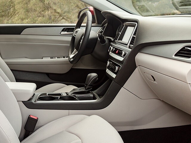 white car interior with piano black center console