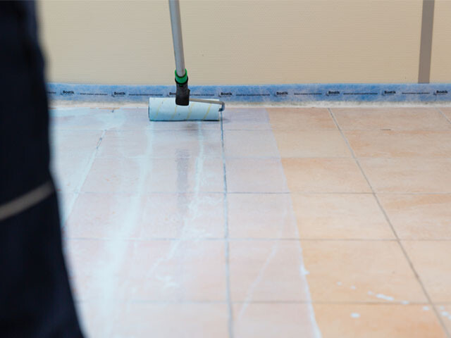 Application of a flooring primer on an old tile floor