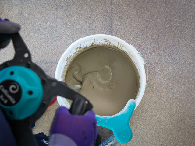 Mixing with an electric drill and recommended mixing paddle until a smooth lump-free mixture is formed.