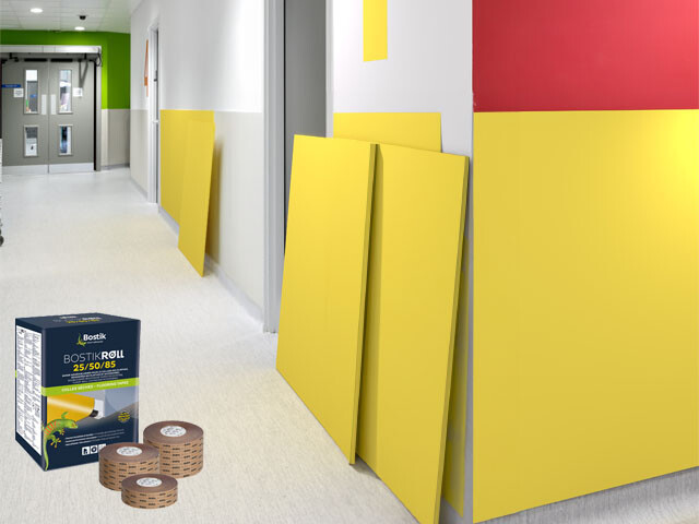 Hospital corridor with panels against the wall