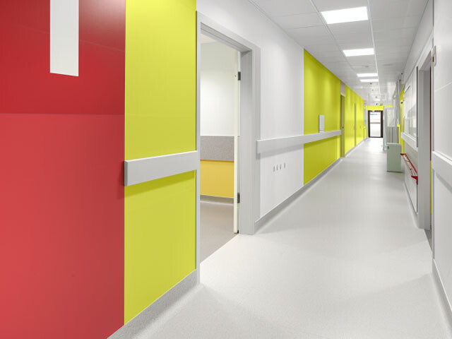 Hospital corridor with walls that have protective panels