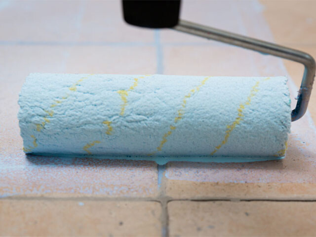 A foam roller covered with the flooring primer