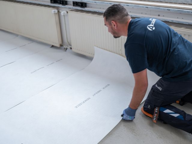 Positioning Bostik decoupling underlay sheet