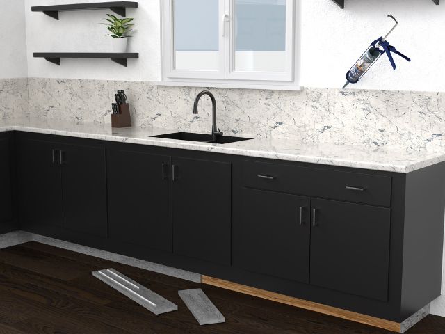 Bostik adhesive application setup for installing stone kitchen countertops and cabinetry.