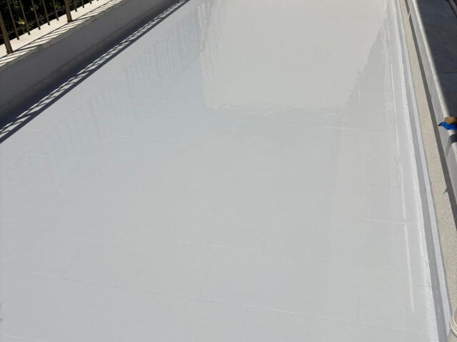 flat waterproofed roof top-down view smooth grey finish