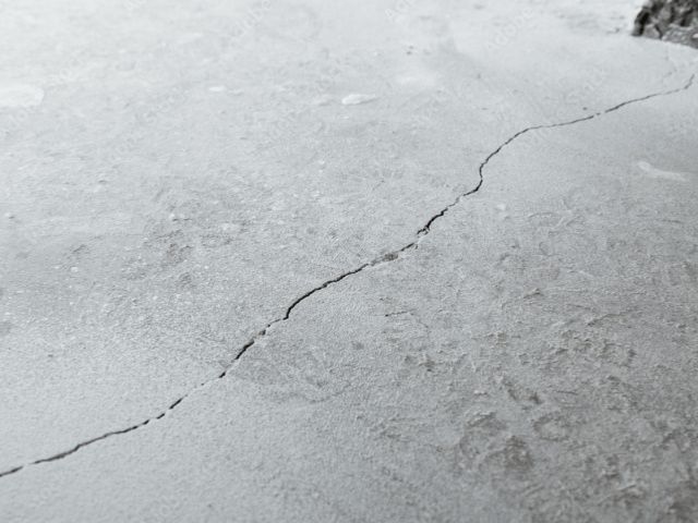 Crack visible in a concrete subfloor