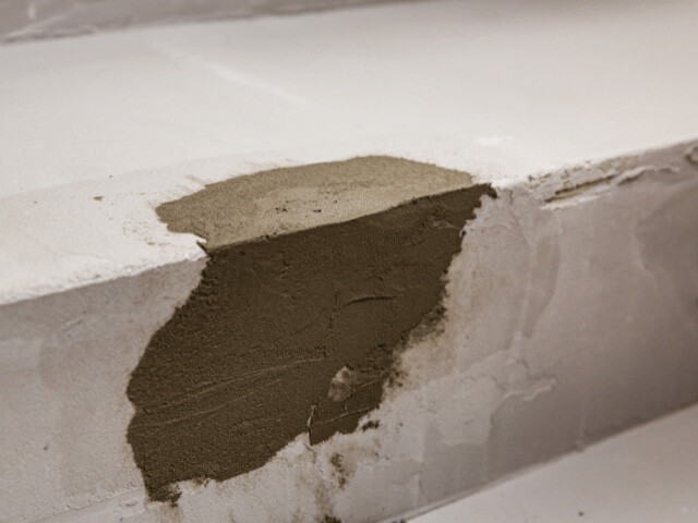 fixed patch of concrete on a 90 degree angle