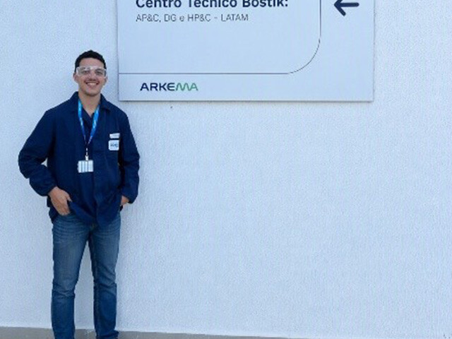 Matías Ali in front of Arkema and Bostik signage