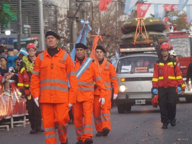 rescue workers in a parade on the street