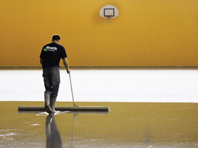 Floor Preparation image person preparing a floor using Bostik floor preparation products