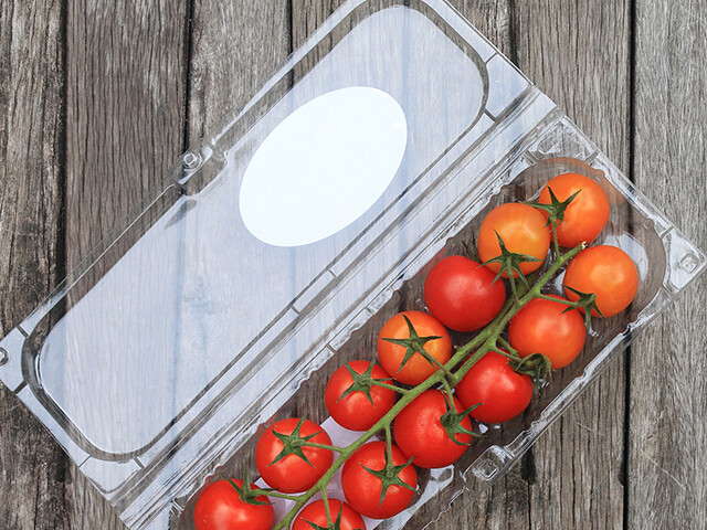 plastic container holding vine-ripened tomatoes