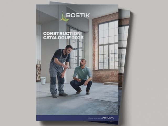 Cover of the Bostik Construction Catalogue 2026 featuring two people reviewing flooring work inside a modern interior space with large industrial-style windows and exposed brick walls. The Bostik logo appears at the top, with the title 
