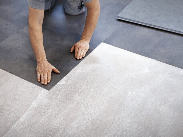 What glue for an LVT floor located behind a bay window conservatory, atrium or glass fronted building?