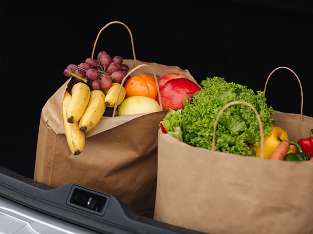 grocery bags stacked ready to be used at the end of a check out lane