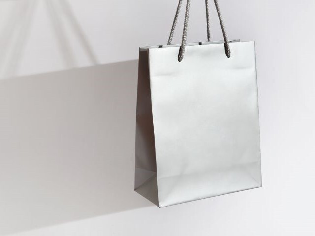 Luxury silver giftbag shimmers slightly against a white background. 