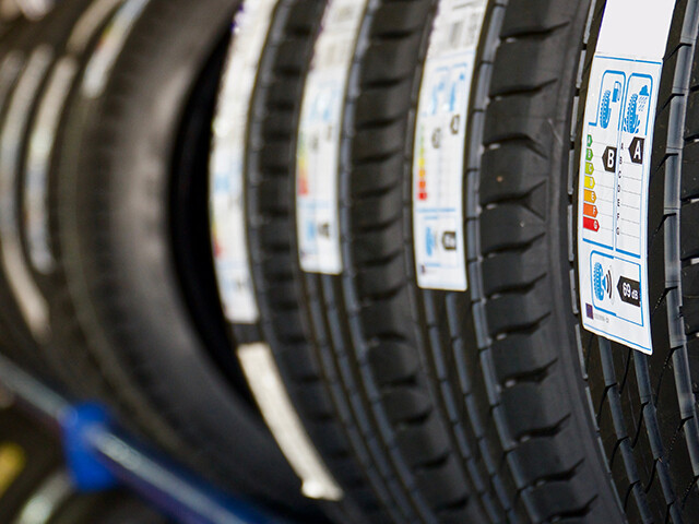 tires with labels adhered to the treads